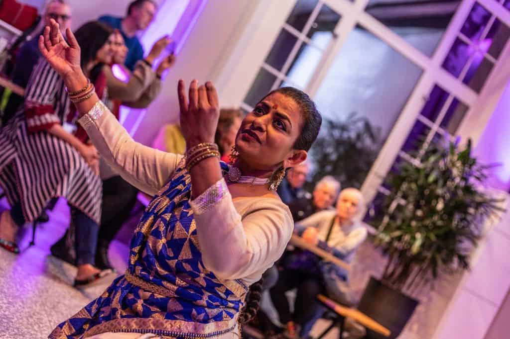 Photograph of south Asian performer in museum hall