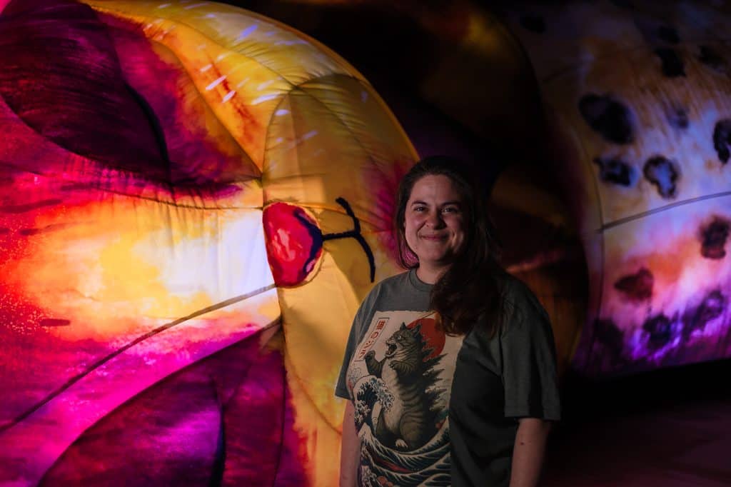 Manchester Museum's Curator of Indigenous Perspectives, Alexandra Alberda, stood in front of a giant inflatable cat.