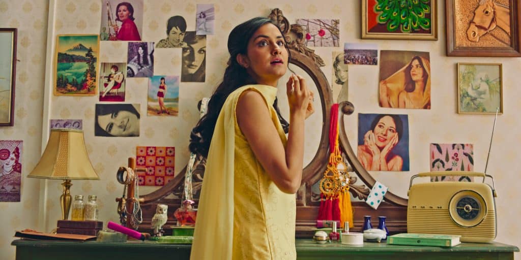 South Asian woman wearing yellow. An image advertising the film The Queen of My Dreams.